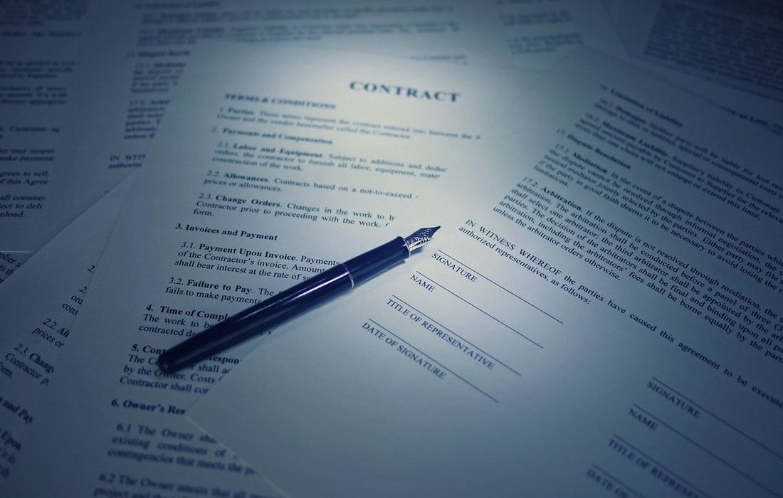 A contract and pen