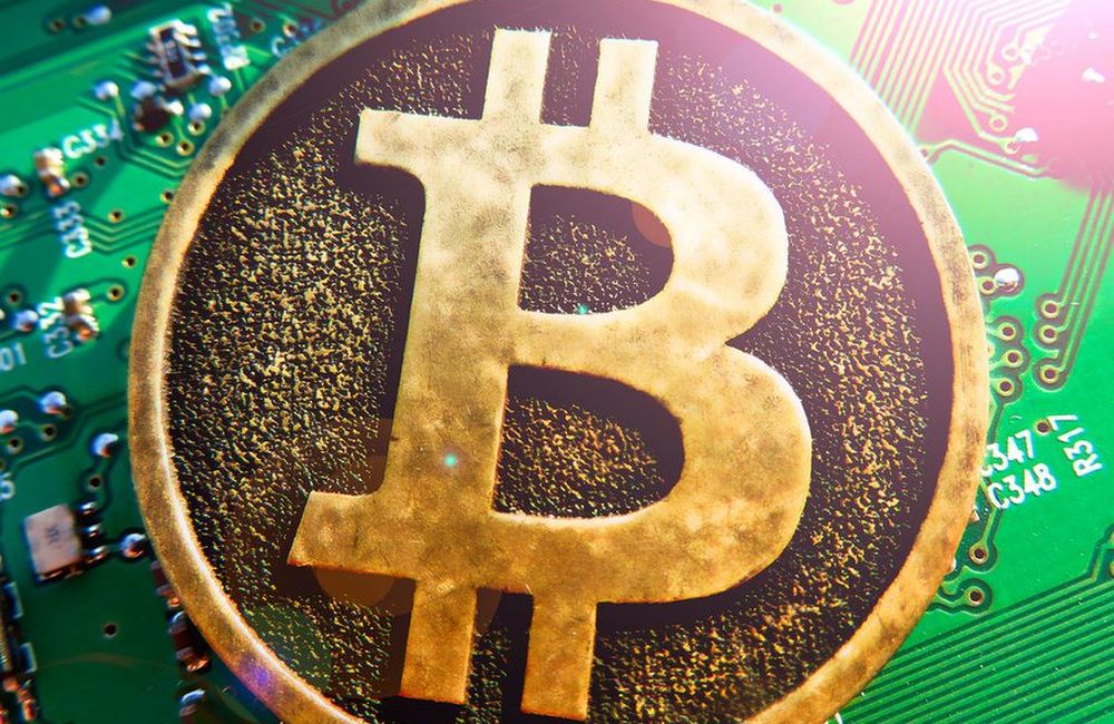 A cryptocurrency coin resting on circuitry
