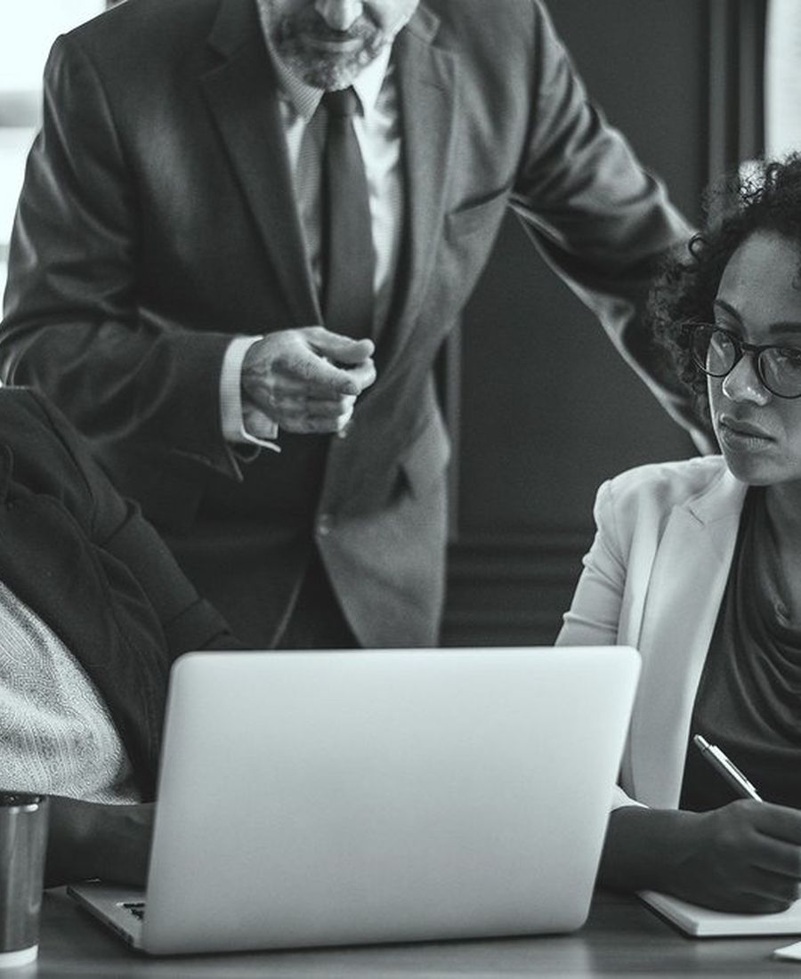 An analyst working through transaction records